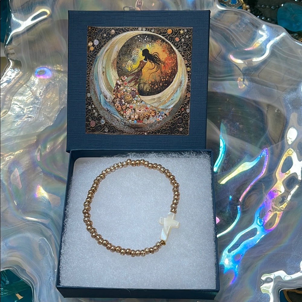 Elegant Gold Tone Beaded Bracelet with White Cross Charm